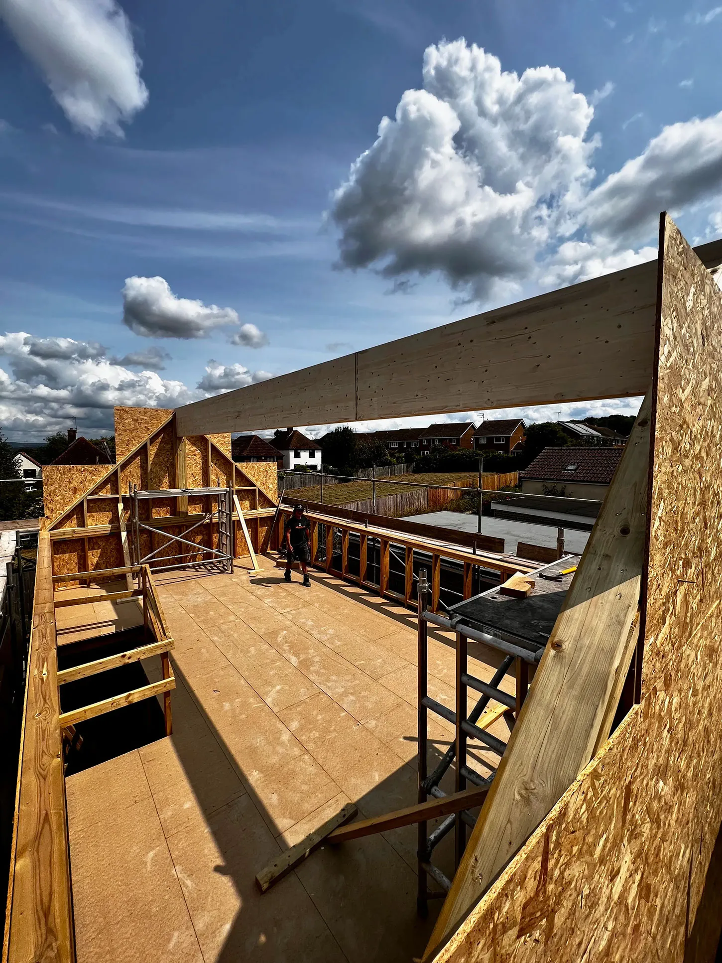 a view of a wooden roof with a sky background