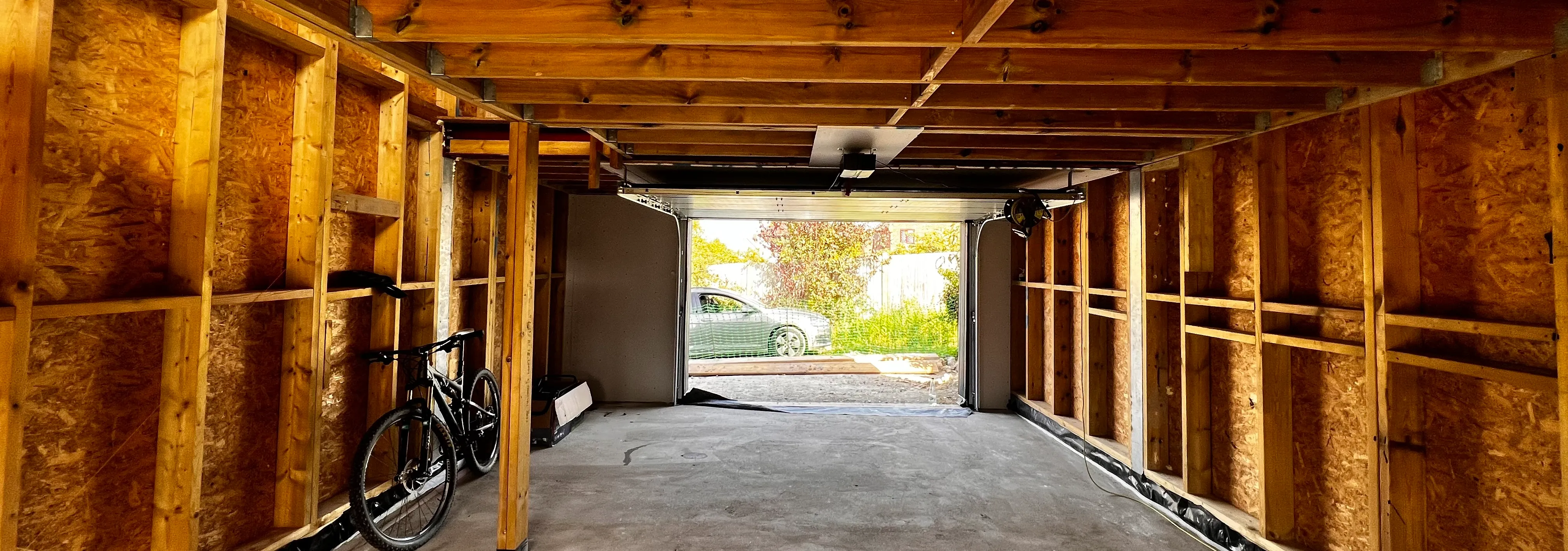 a garage with a bike in the middle of it