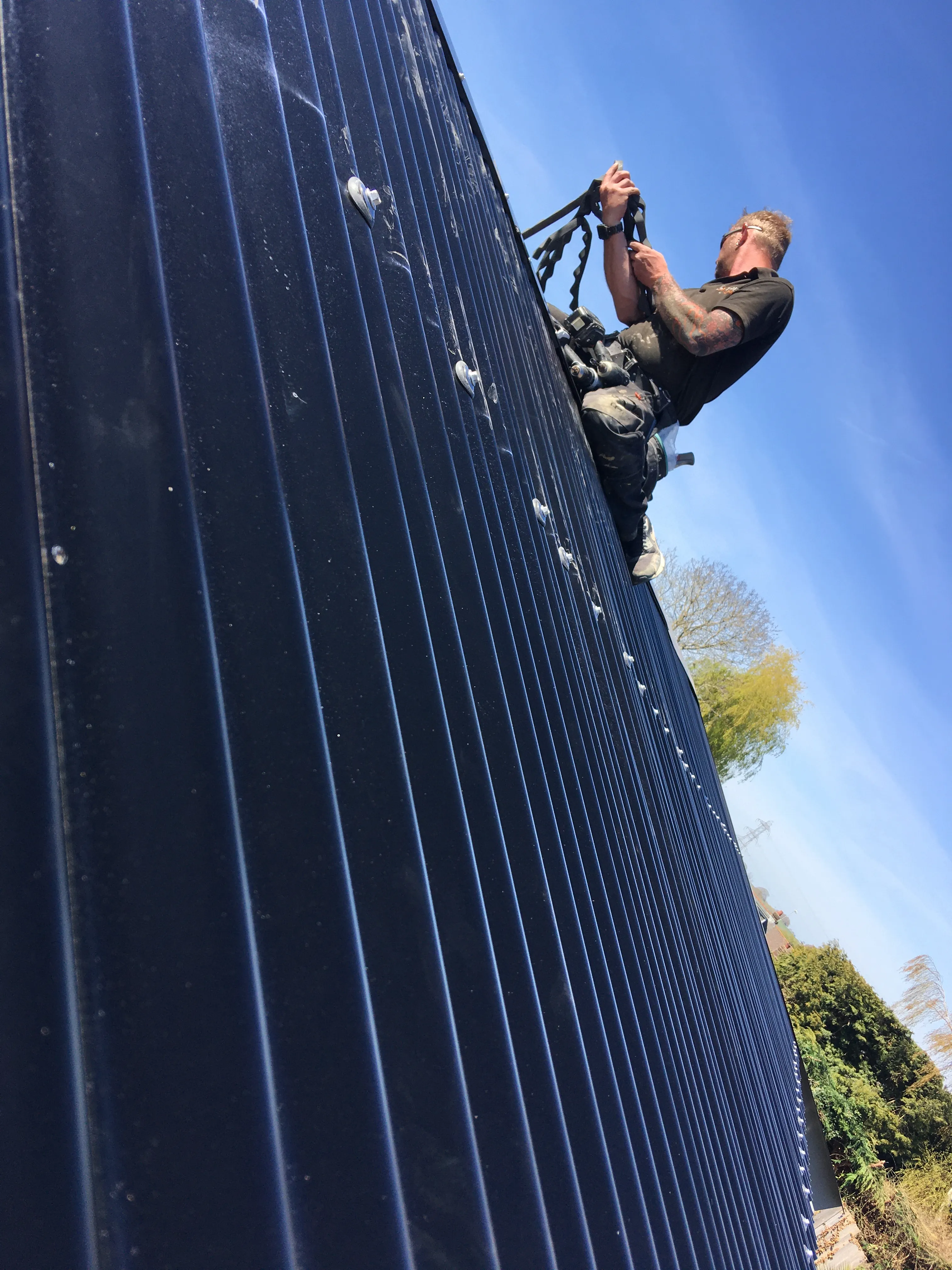 a man climbing up the side of a building