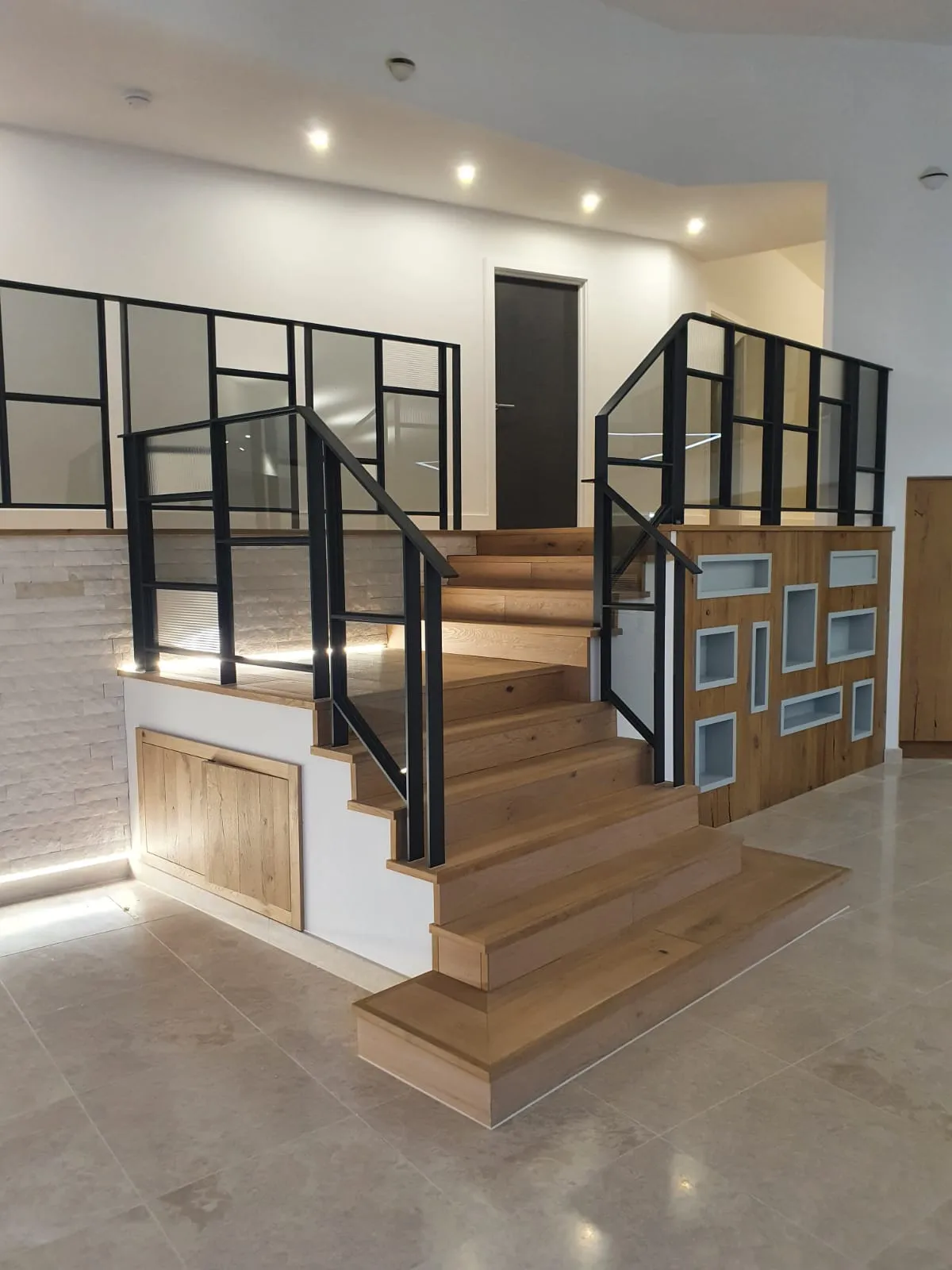 a staircase in a building with glass balconies