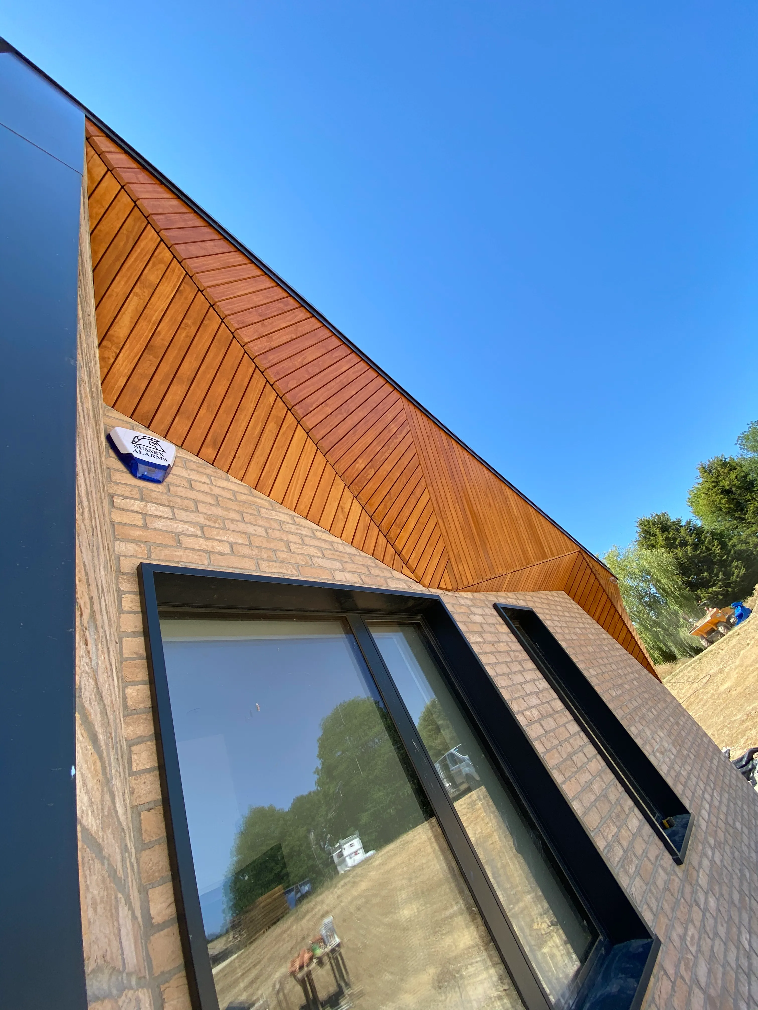 a close up of a brick building with a sky background